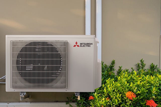 Mitsubishi Electric cold-climate heat pump outdoor unit installed on an Ontario home